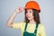 teen girl in helmet and boilersuit. child wear hard hat. kid builder on construction site. worker engineer. architect in