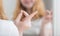 Teen girl holds blue eye lens