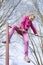 Teen girl on the horizontal bar in the park. Outdoors activity