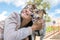 Teen girl hugs dog Jack Russell Terrier in the park