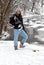 Teen girl with ice skates in snow