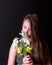 Teen girl Inhale aroma of bouquet of daffodils