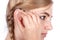 Teen girl inserting a hearing aid