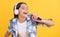teen girl karaoke singer in headphones on background. photo of teen girl karaoke singer