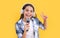 teen girl karaoke singer wear headphones isolated on yellow. teen girl karaoke singer
