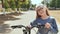 Teen girl kisses the wheel of her favorite bike.