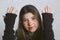 Teen girl in knitted brown glows close up portrait