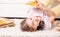 Teen girl laying with pizza on the floor