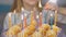 Teen girl lights candles on cake on her birthday