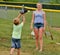 Teen girl and little Brother Playing Catch