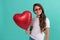 teen girl with party balloon. love present. happy smiling kid with love romantic gift. sweetheart