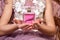Teen girl with pink parfume bottle in her hands