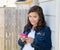 Teen girl playing music with smartphone earings