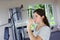 Teen girl with pony tail jogging on treadmill