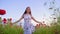 Teen girl on poppy field