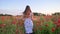 Teen girl on poppy field