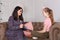 Teen girl on reception at the psychotherapist. Psychotherapy session for children. The psychologist works with the patient. The
