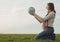 Teen girl sitting with a globe