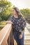 Teen Girl Standing on Bridge