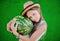 Teen girl in a straw hat holding a large watermelon. Girl teenag