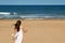 Teen girl summer beach running with ice cream