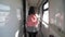 Teen girl walks on a train compartment car with a backpack. Travel transportation railroad concept.Little girl walking