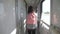 Teen girl walks on a train compartment car with a backpack . travel transportation railroad concept.little girl walking