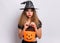 Teen girl in witch black hat