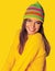 Teen girl in yellow winter clothes