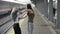 Teen girls reunited meeting in train station taking photo selfie with smartphone and having fun before summer trip