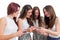 Teen girls sharing information on smart phones