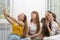 Teen girls spend time together at home