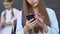 Teen girls using cellphones, chatting in social network, internet addiction
