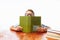 Teen guy fell asleep sitting with books, student sleeping at Desk in Studio on white background