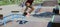 Teen guy jumps on skateboard