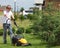 Teen helps mow the lawn