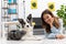 The teen and her dog lie on the floor together, relaxing in their spare time from exercising. Intelligent Border Collie