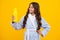 Teen holds water bottle isoalted on yellow. Child girl care body hydration. Active leisure and morning water balance