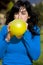 Teen inflating yellow balloon