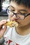 Teen Kid Eating Fried Chicken Drumstick