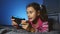 Teen kid girl playing portable video online game a console kid at night indoors