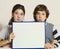 Teen kids boy and girl hold blank paper sheet