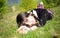 Teen lying on grass thinking