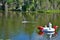 Teen paddle boarding to a huge inflatable unicorn floaty in the middle of a lake upper peninsula michigan