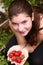 Teen pretty girl with handful of ripe strawberries