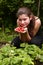 Teen pretty girl with handful of ripe strawberries