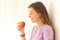 Teen ready to eat an apple indoors