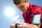 Teen runner checking settings on smart watch.