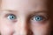 Teen\'s blue eyes staring up