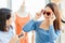 Teen shopping, girl teen trying and buying cute fancy heart shaped sunglasses happy enjoy shopping with friends